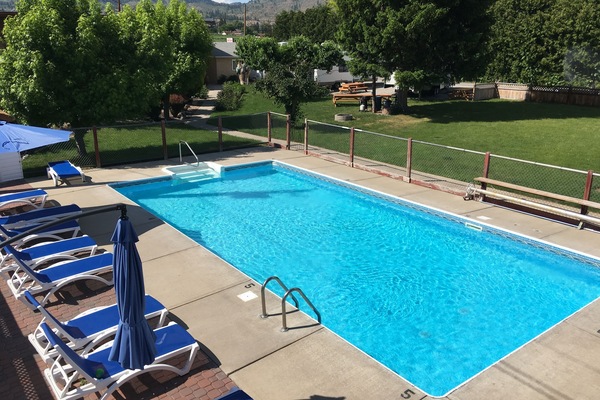 Seasonal outdoor pool, open 10:00 AM to 8:00 PM, pool umbrellas