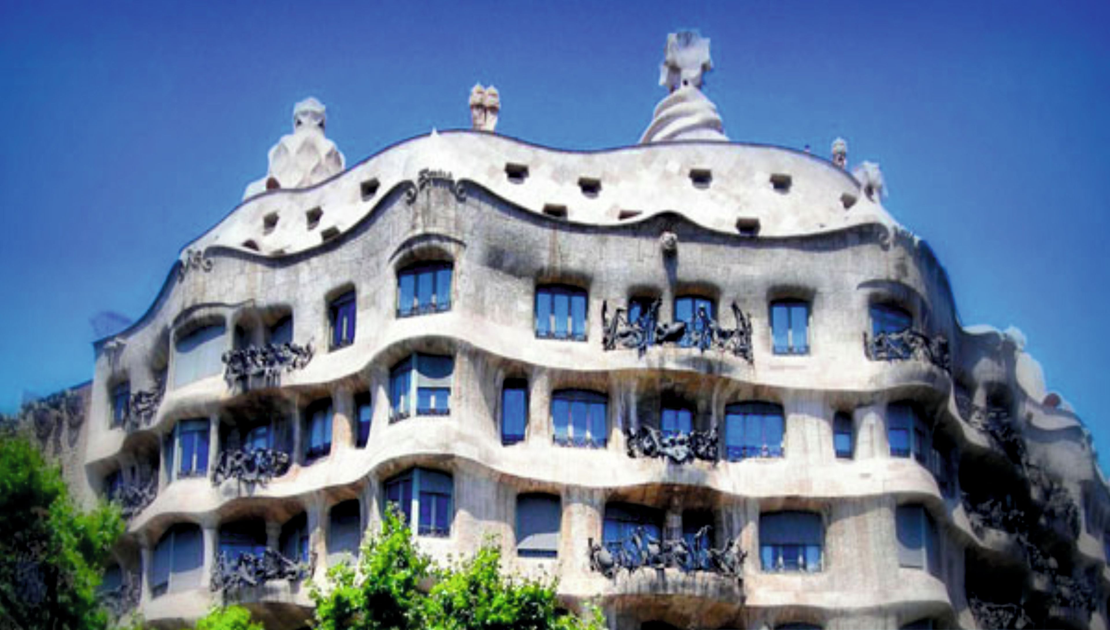 A building with a unique architectural style, featuring balconies and a curved facade.