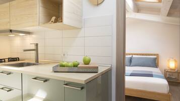 1 bedroom, desk, iron/ironing board, travel crib