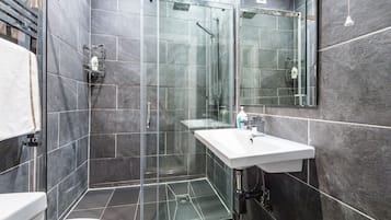 Shower, hair dryer, towels, soap