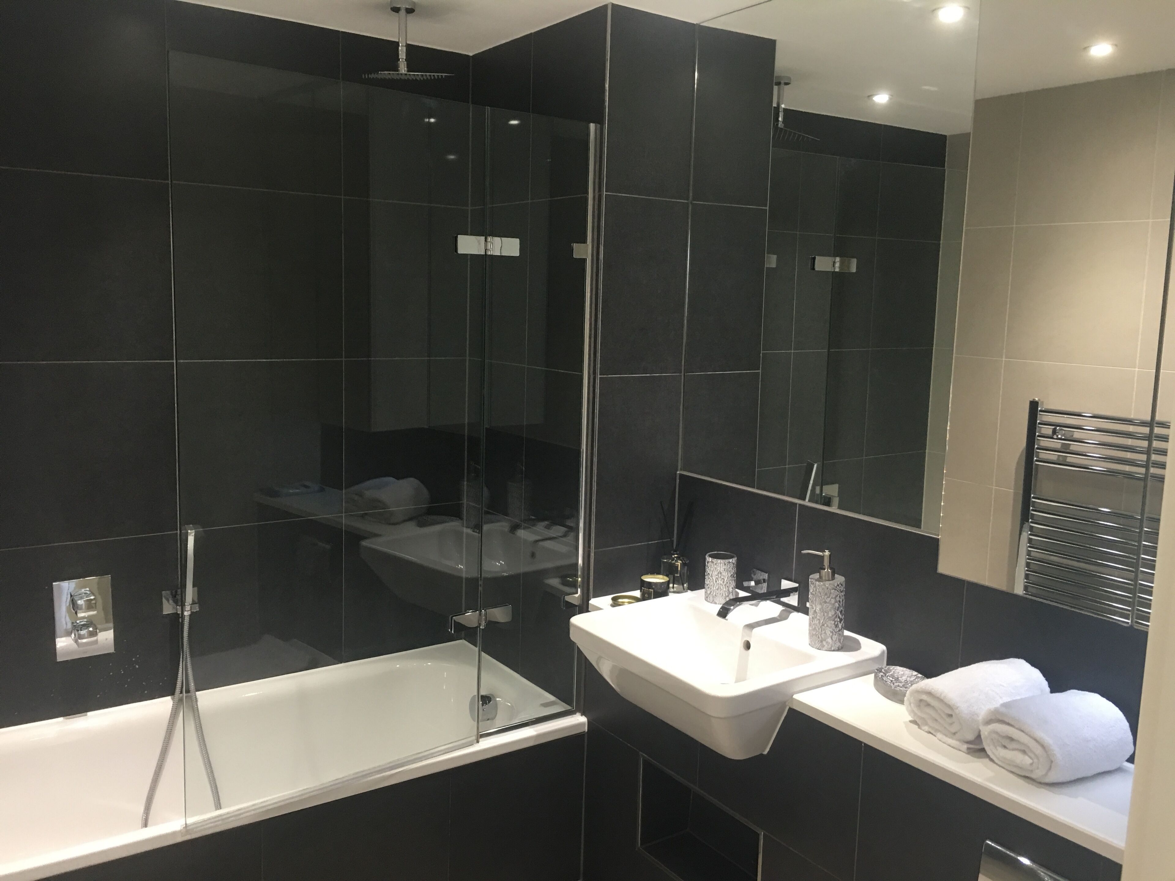 Combined shower/bathtub, hair dryer, towels, soap