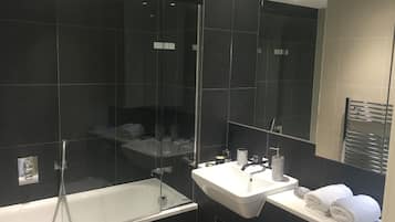 Combined shower/bathtub, hair dryer, towels, soap