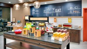 A breakfast buffet area with various food items and a chalkboard menu. - Hampton Inn Draper Salt Lake City Ut (Draper)