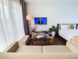 Executive Double or Twin Room | Living room | 50-inch LCD TV with premium channels, TV - Reiwa Inn Apartment (Hanoi)
