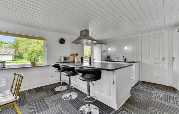 Fridge, stovetop, dishwasher, coffee/tea maker