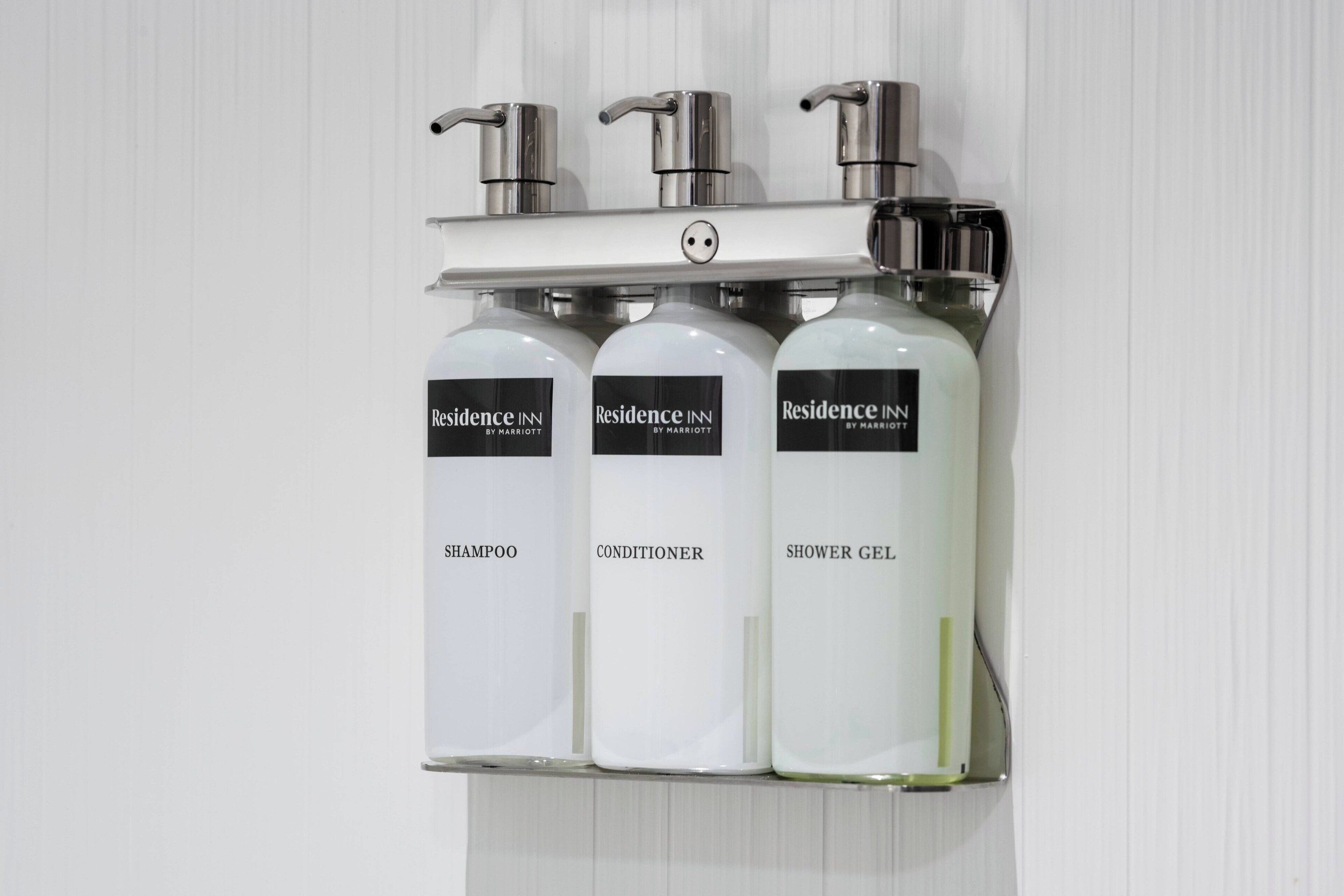 designer toiletries, hair dryer, towels, soap