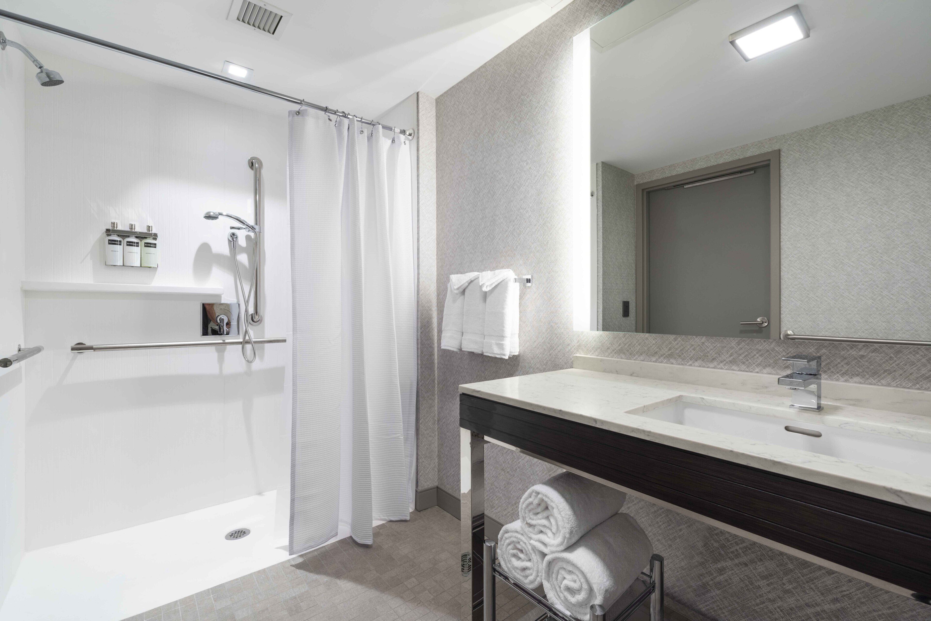suite, 1 bedroom (mobility/hearing access, roll-in shwr) | bathroom | designer toiletries, hair dryer, towels, soap