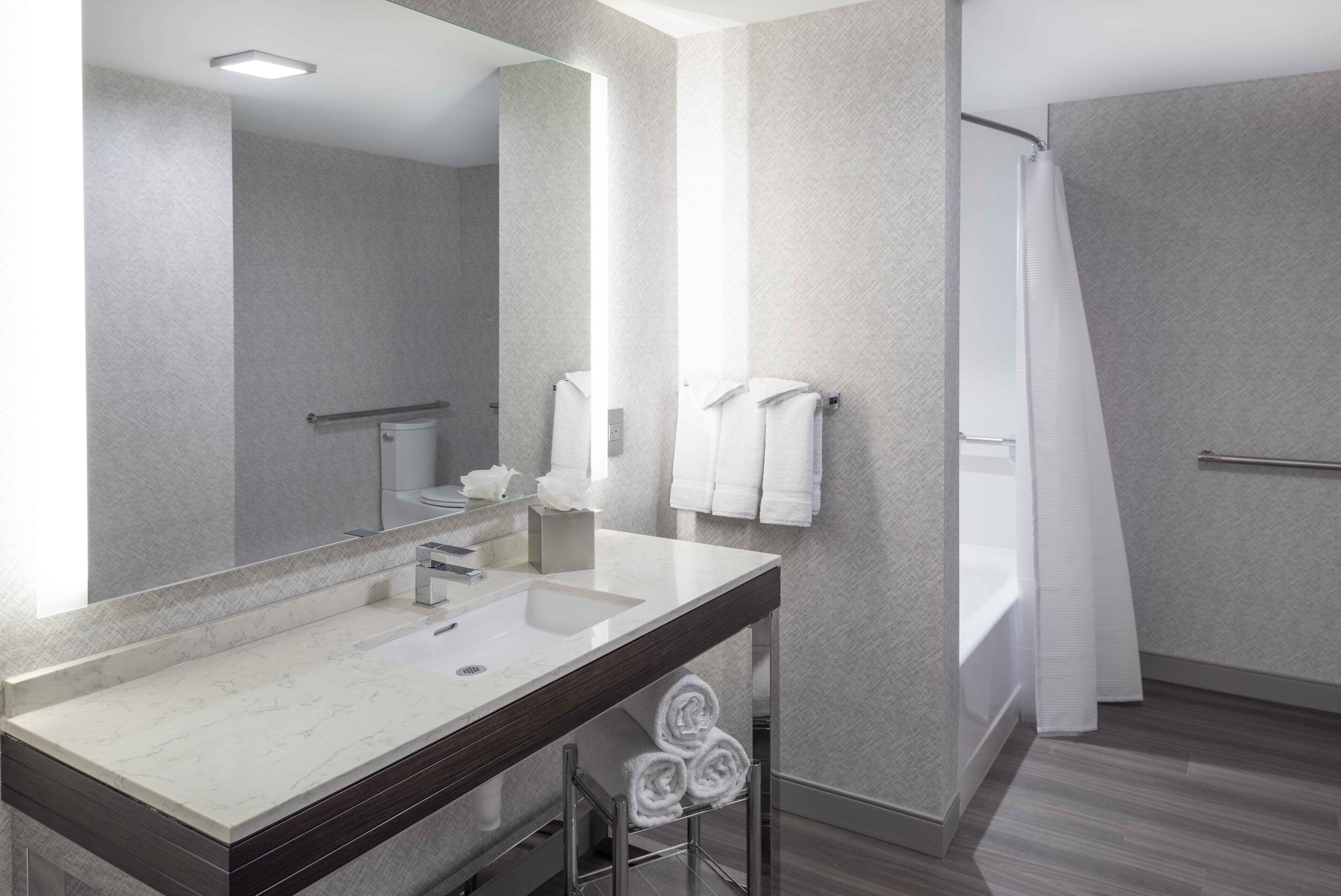 suite, 1 bedroom (mobility/hearing accessible, tub) | bathroom | designer toiletries, hair dryer, towels, soap