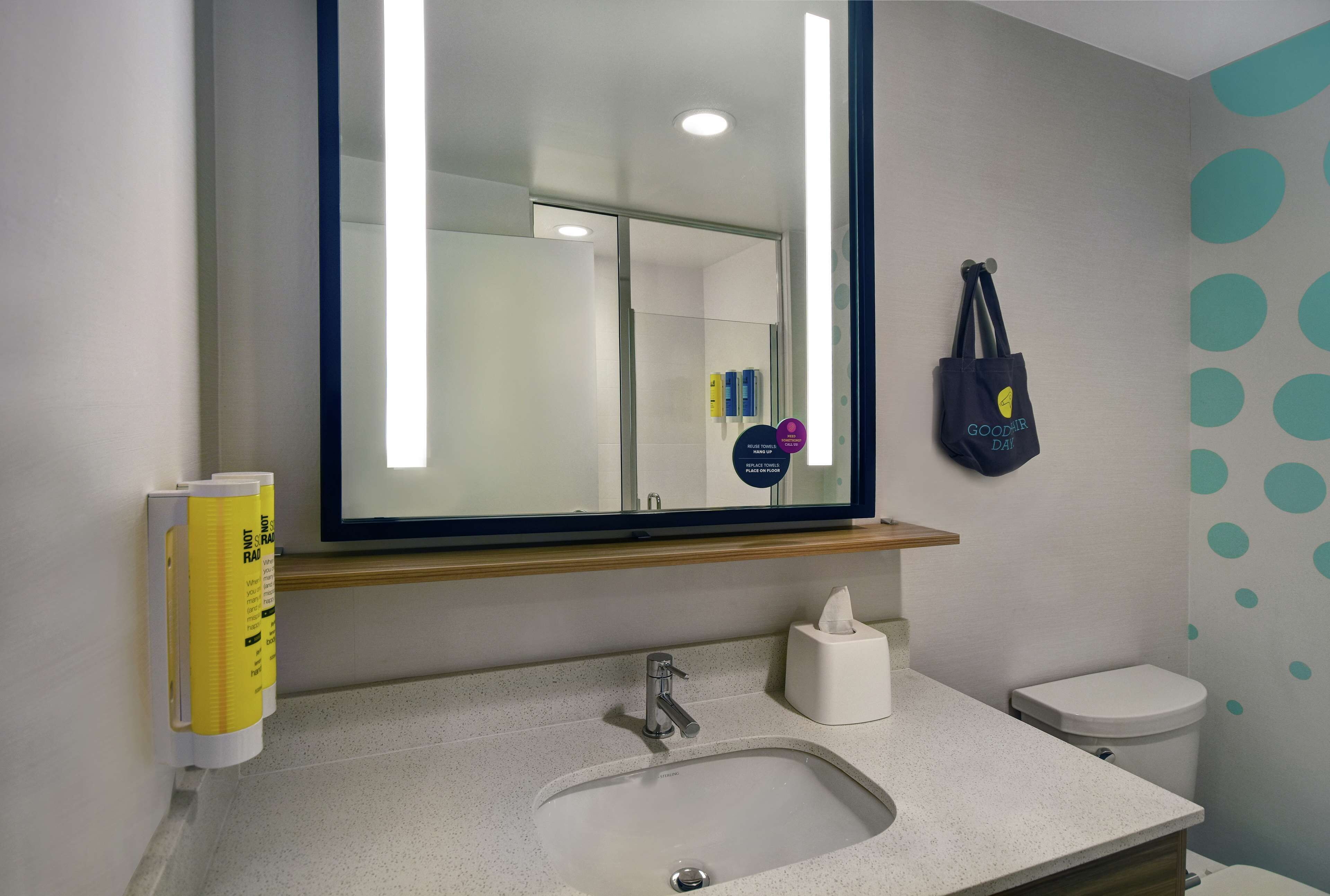 designer toiletries, hair dryer, towels, soap