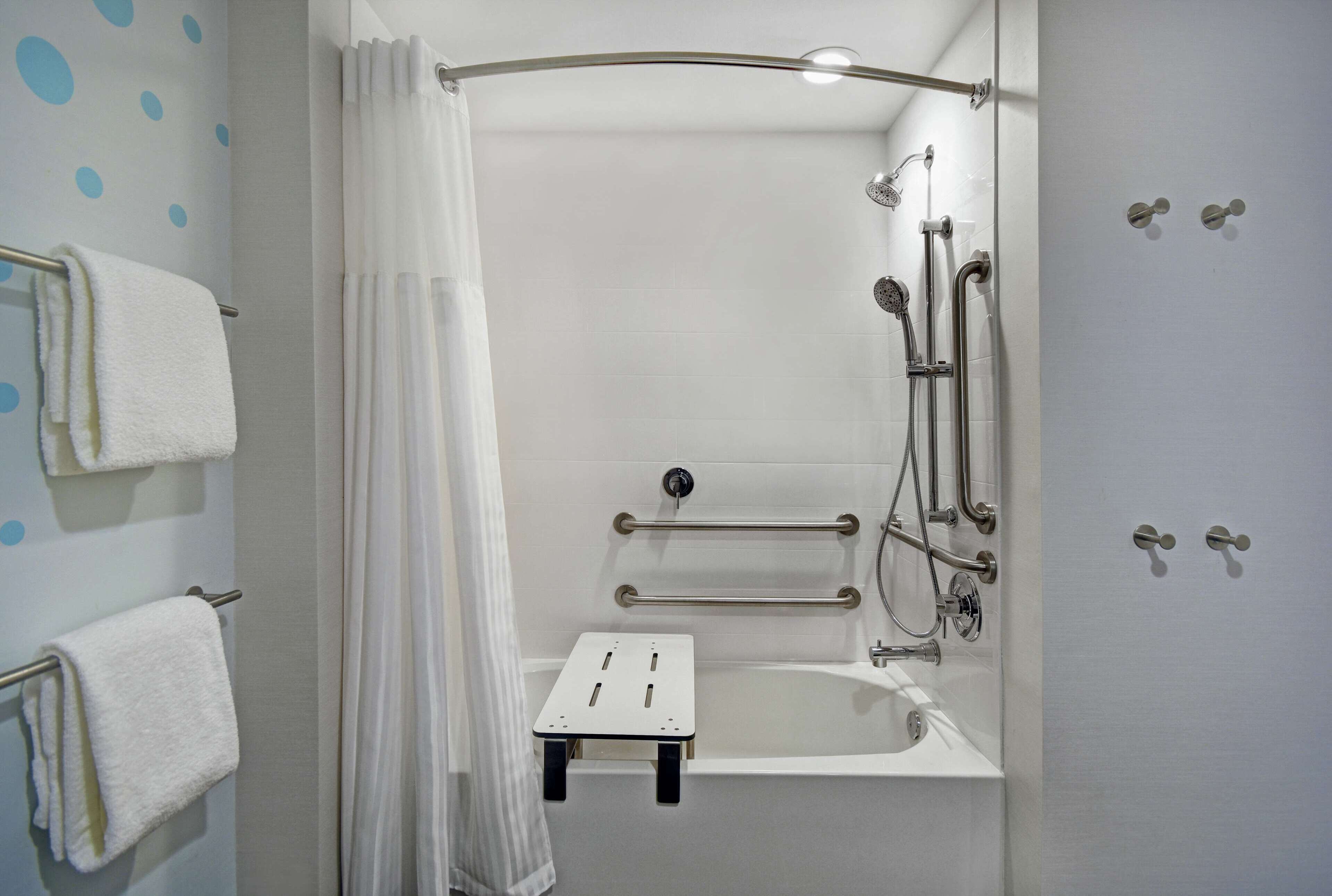 designer toiletries, hair dryer, towels, soap