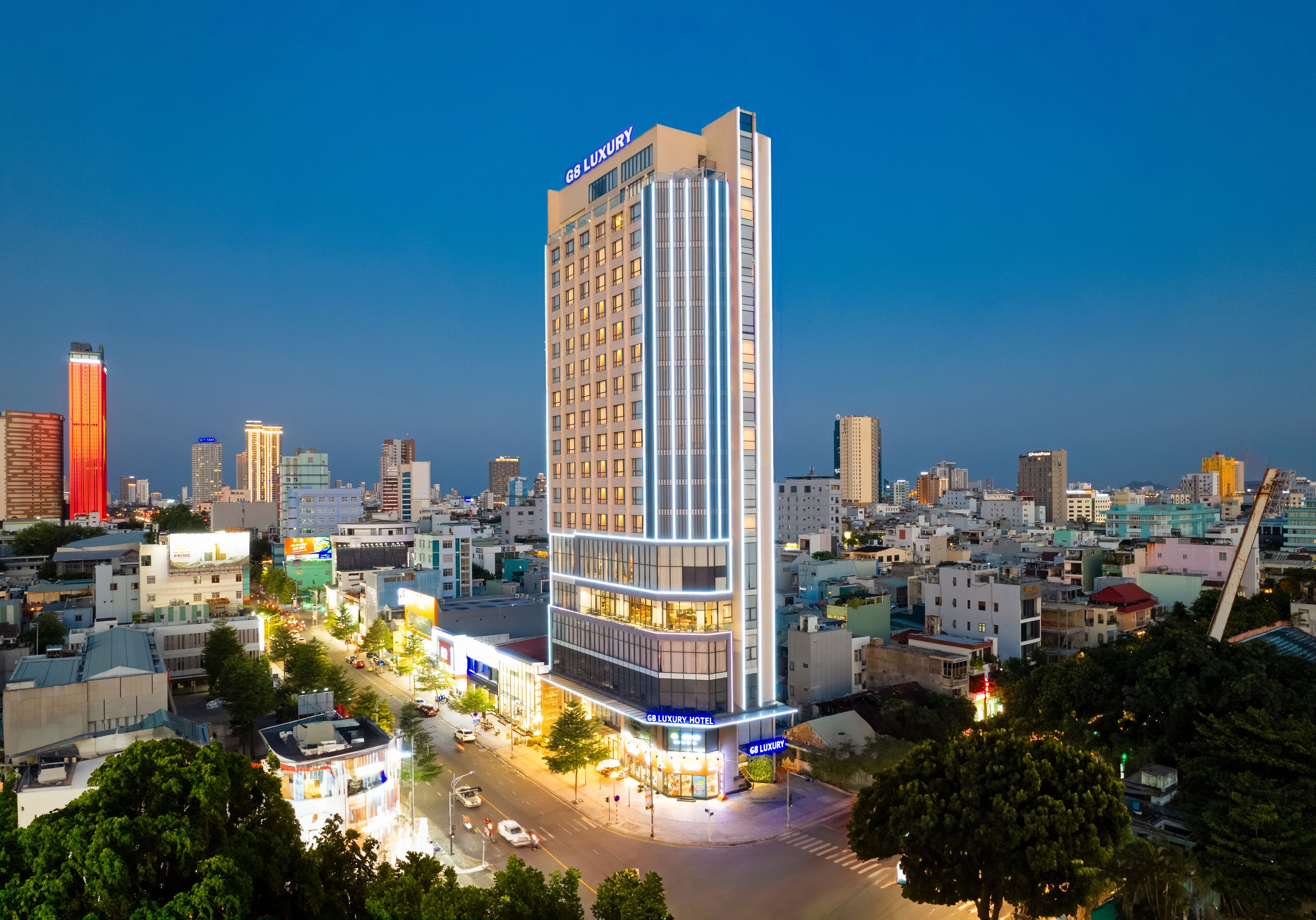 A high-rise hotel with a modern design, multiple floors, and illuminated signage.