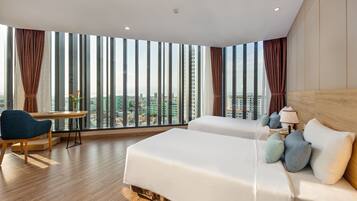 Family Room, 2 Bedrooms, City View | Minibar, in-room safe, desk, laptop workspace