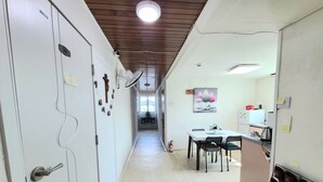 A hallway with a dining area, a kitchen, and a staircase. - YeoU (Mungyeong)