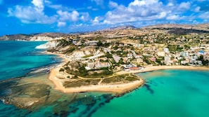 Beach nearby, white sand, beach towels