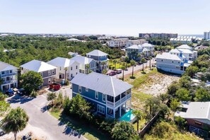A residential area with multiple two-story houses, each featuring a prominent front porch and a swimming pool. - Heated Private Pool*, Walk to the Beach! Golf Cart & 6 Bikes! - Blue Dune 30A in Blue Mountain Beach (Santa Rosa Beach)