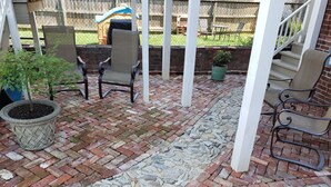 A patio with brick flooring, a stone pathway, and outdoor furniture. - Downtown, 2 Parking spaces, Historic Beauty (Richmond)