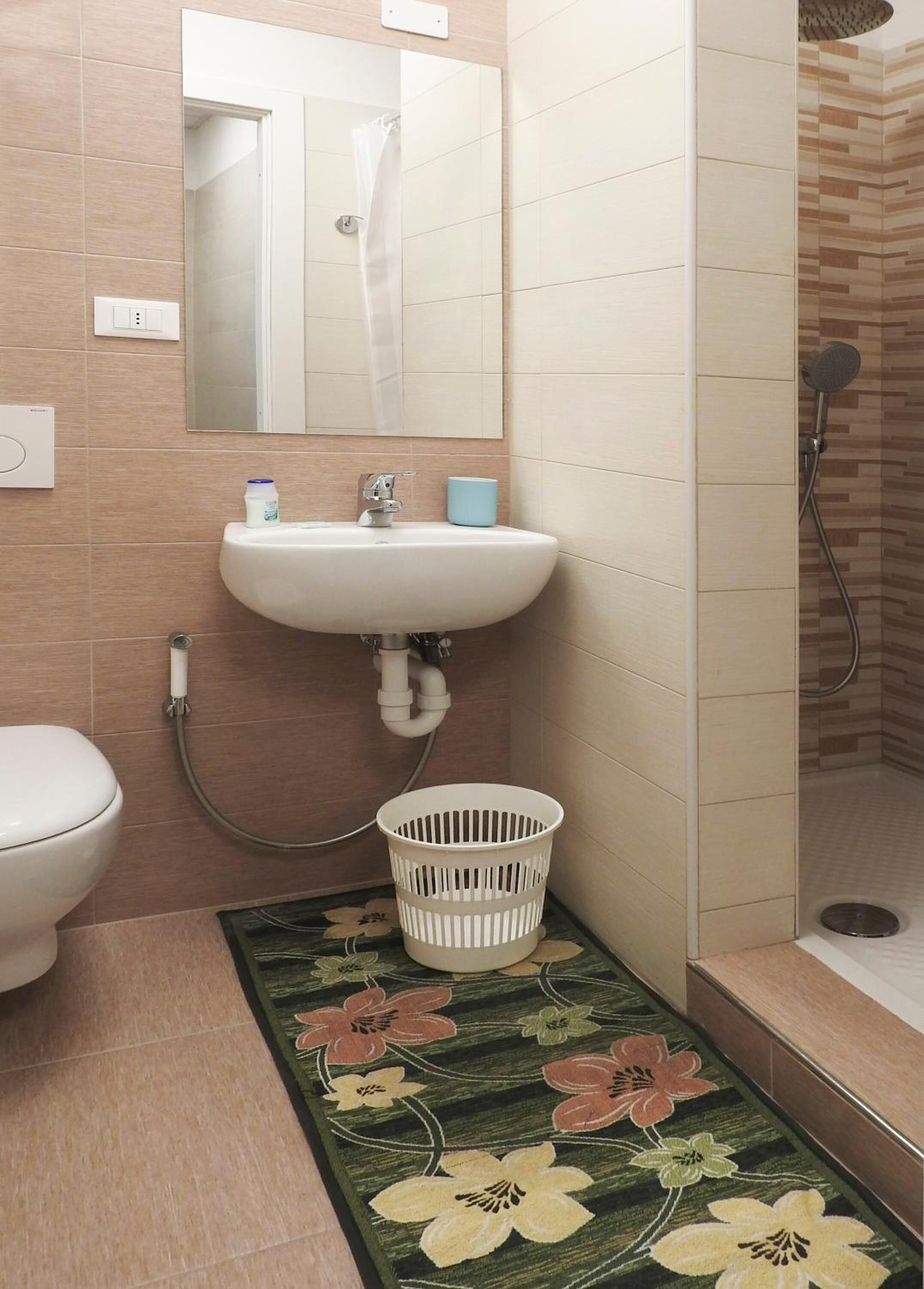 shower, rainfall showerhead, hair dryer, towels