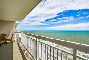 A balcony with a view of the ocean, a white railing, and wicker furniture. - Beautiful Oceanfront Family Condo with Amenities Youll Love | Crescent Shores - S 1709 (North Myrtke Beach)