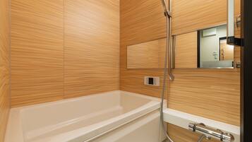 Separate bathtub and shower, free toiletries, hair dryer, slippers