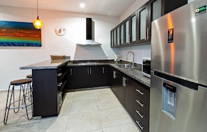 Fridge, microwave, stovetop, coffee/tea maker