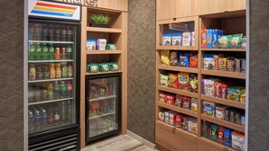 A corner market with refrigerated beverages, snacks, and packaged goods. - Fairfield Inn & Suites by Marriott Vero Beach (Vero Beach)