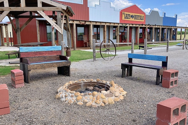 gather around the fire at The Lazy Buffalo