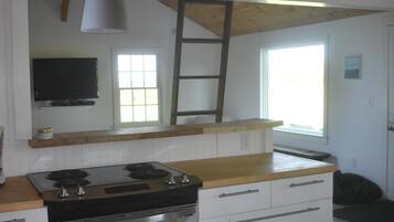 Microwave, dishwasher, coffee/tea maker, cookware/dishes/utensils