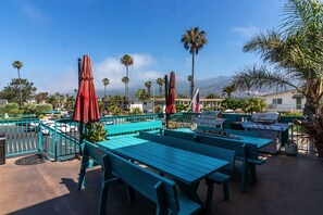 Enjoy dining and socializing at our outdoor patio, featuring picnic tables, barbecue grills, and shaded seating.