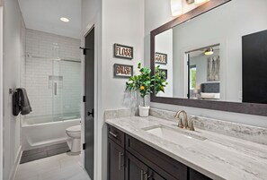 Combined shower/tub, hair dryer, towels, soap