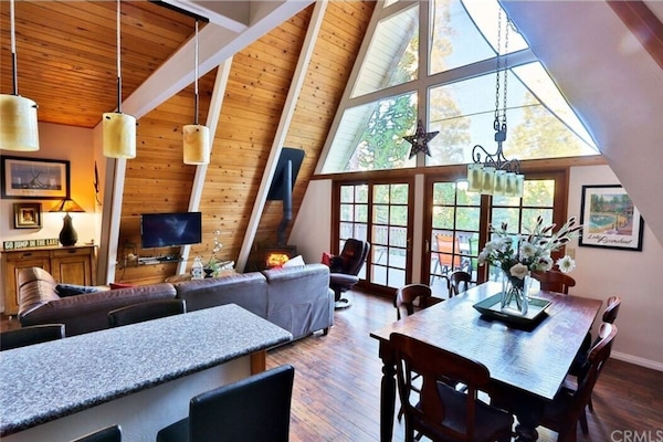 Large Worldmart dining room table that can seat 8 as well as 4 in adjacent bar.