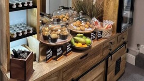 A breakfast buffet with various food items and labels. - The Wheatsheaf Inn (Nottingham)
