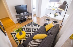 Apartment, 1 Bedroom | Living room | Flat-screen TV