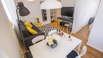 Apartment, 1 Bedroom | Desk, laptop workspace, iron/ironing board, free cribs/infant beds