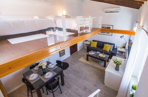 Studio (Duplex) | Desk, laptop workspace, iron/ironing board, free cribs/infant beds