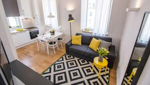 A modern apartment with a kitchen, dining area, and living room. - Furioso Apartments (Split)