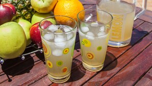 A poolside table with fruits, drinks, and a pitcher. - SUNLIGHT VILLA WITH PRIVATE POOL  FOR FAMILIES AND FRIENDS TO ENJOY (Myrtia)