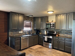 Fridge, microwave, oven, stovetop - Windmill Springs In Gruene With River frontage! Walking distance to Gruene Hall! (New Braunfels)