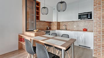 Deluxe Apartment (Parking) | Private kitchen | Full-size fridge, oven, stovetop, dishwasher