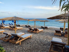 On the beach, sun loungers - Windmill Tower Beach House in Rhodes island (Ialisos)