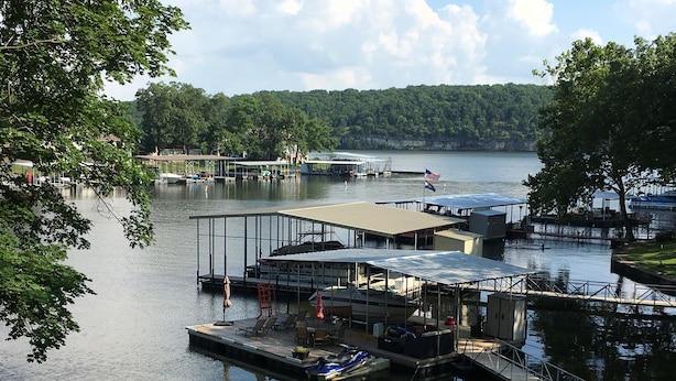 A marina with docks, boats, and a small building with a roof. - Lakefront home near Margaritaville  w/lrg private dock -Kelly’s Place (Osage beach)