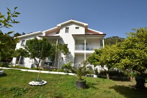 Stunning two-story residence with a balcony and beautifully maintained garden.