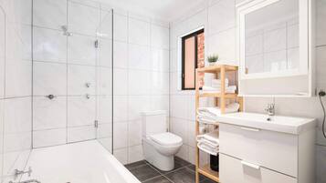 Bathtub, hair dryer, towels, shampoo