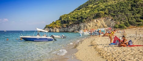On the beach, beach towels, rowing