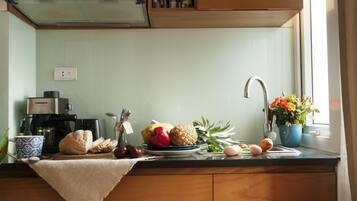 Fridge, microwave, stovetop, coffee/tea maker