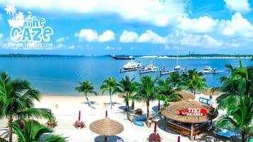 On the beach, sun-loungers