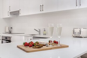 Fresh ingredients and modern appliances come together in this well-equipped kitchen.