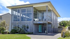 A modern two-story building with large windows and a balcony. - Magnificent views over the Southern Ocean (PORT FAIRY)