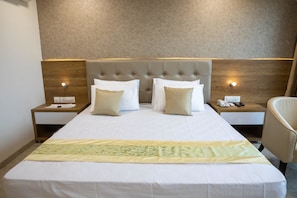 Premium bedding, desk, laptop workspace, rollaway beds