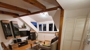 Apartment (Wohnung 3) | Living area | 100-cm flat-screen TV with cable channels, TV, Netflix