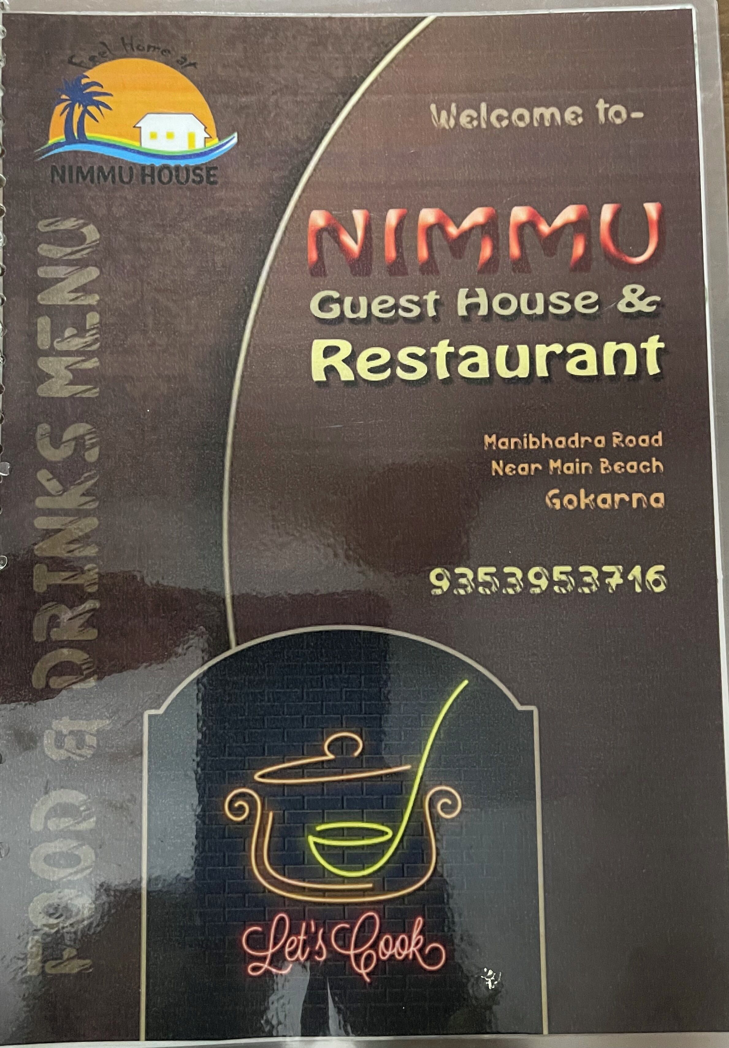 Skilt for NIMMU Guest House & Restaurant, med adresse og telefonnummer.